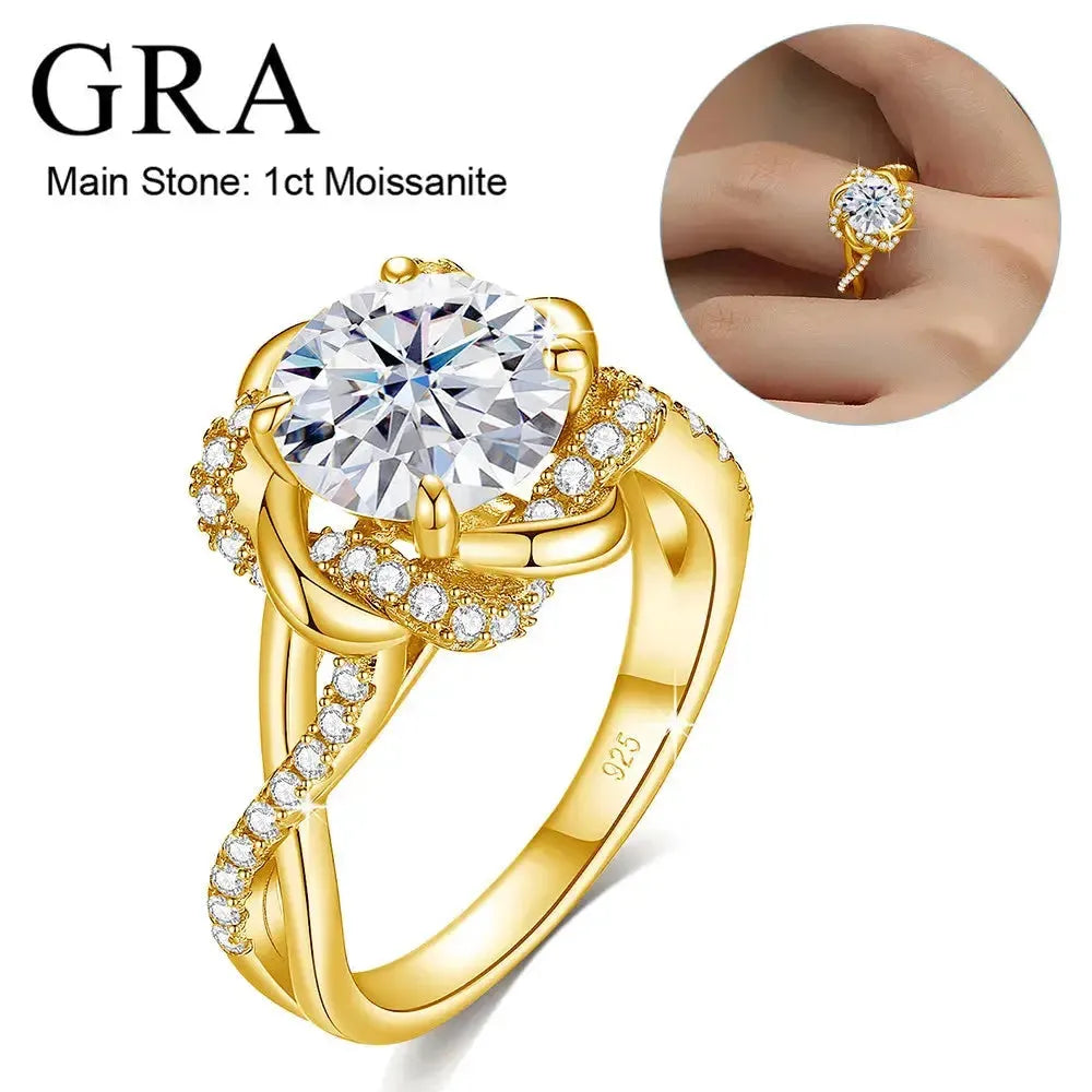 A gold ring with a large, round, brilliant-cut, white moissanite stone, and smaller diamonds along the band.
