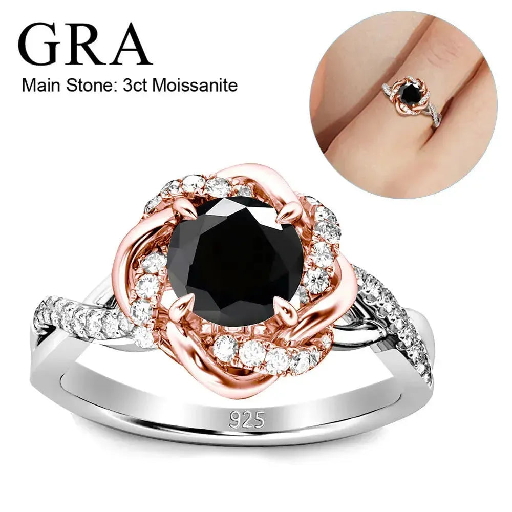 Rose gold and silver ring with a black moissanite center stone surrounded by smaller diamonds. The band is marked "925".
