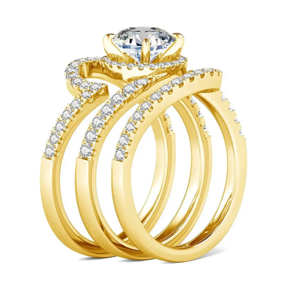 Gold engagement ring set with a large diamond and smaller stones.