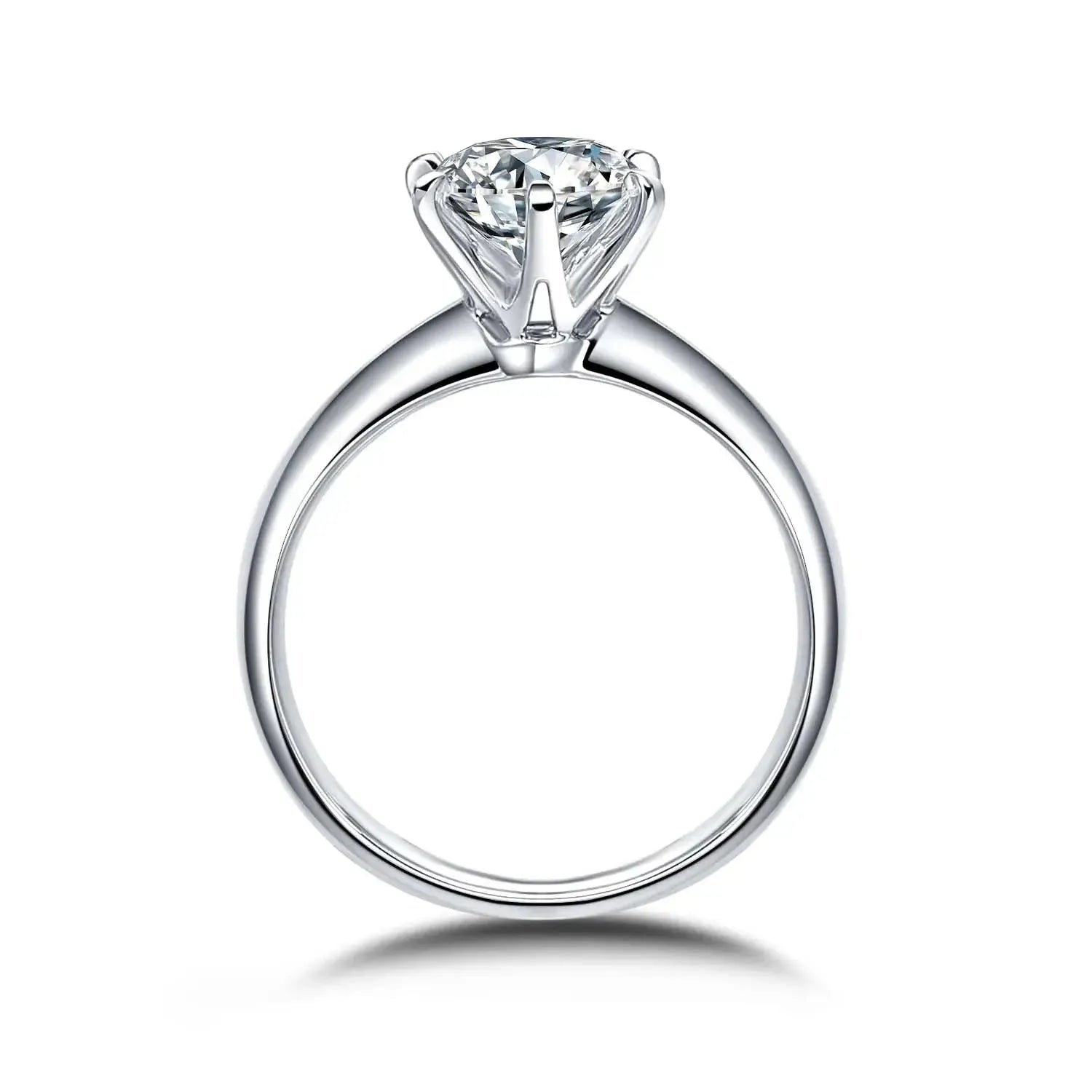 A silver engagement ring with a round diamond set in a classic prong setting.